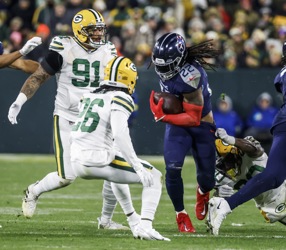 Tennessee Titans wide receiver Robert Woods (2) catches a pass as Green Bay  Packers linebacker Krys Barnes (51) defends during the second half of an  NFL football game Thursday, Nov. 17, 2022