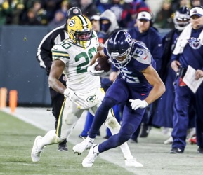 Tennessee Titans wide receiver Robert Woods (2) catches a pass as Green Bay  Packers linebacker Krys Barnes (51) defends during the second half of an  NFL football game Thursday, Nov. 17, 2022