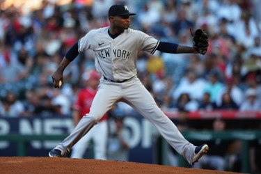 ANAHEIM, CA - JULY 18: New York Yankees pitcher Domingo German (0) pitching  during an MLB baseball game against the Los Angeles Angels played on July  18, 2023 at Angel Stadium in