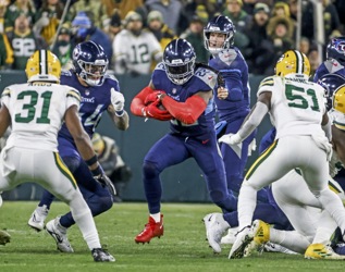 Tennessee Titans wide receiver Robert Woods (2) catches a pass as Green Bay  Packers linebacker Krys Barnes (51) defends during the second half of an  NFL football game Thursday, Nov. 17, 2022